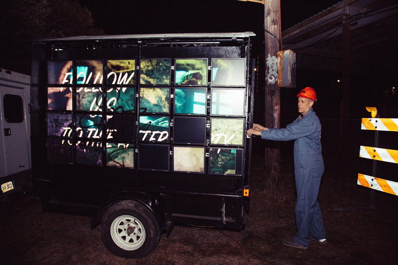 Krewe member Transceiver pulls out his creation — an homage to the advertising billboard trucks that roll through New Orleans. He used 48 monitors donated by a private school, 48 raspberry pi computers, and the program info-beamer — which runs off his cell phone — to change the content in real time, so the videos can comment on what’s nearby. Photo: Akasha Rabut.